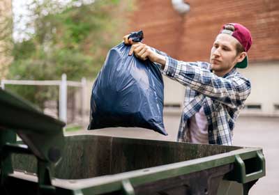 Man throwing out food after bed bugs