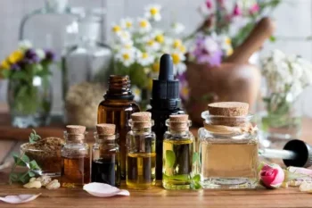 Group of essential oils on a tabletop with flowers - Keep rodents away from your property with Russell's Pest Control in Knoxville TN